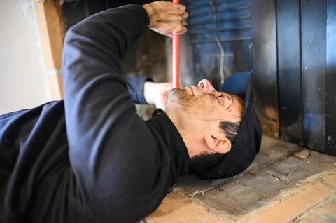 Young chimney sweep at work Photos