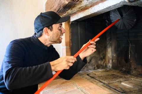 Young chimney sweep at work Stock Photos