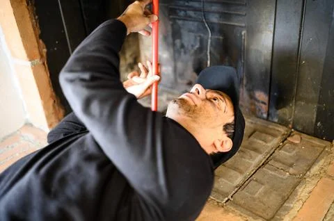 Young chimney sweep at work Stock Photos