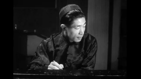 Young Chinese Man Keeping Score For Female Bowlers Stock Footage 110794307