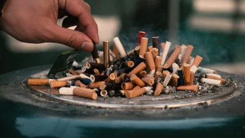 Young Chinese man put out cigarette stubs 스톡 동영상 145690133