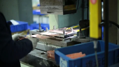 Young Chinese manual worker operating in factory,HD Stock Footage 117897492