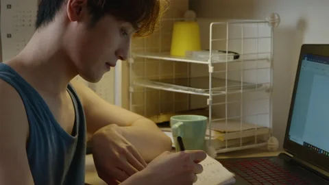 Young Chinese university student learning in dormitory,4K Stock Footage 211549281