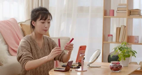 Young Chinese woman doing live webcast at home,4K Stock Footage 118406853