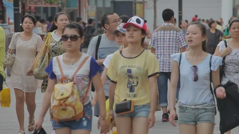 Young Chinese women, Beijing shopping street, China Stock Footage