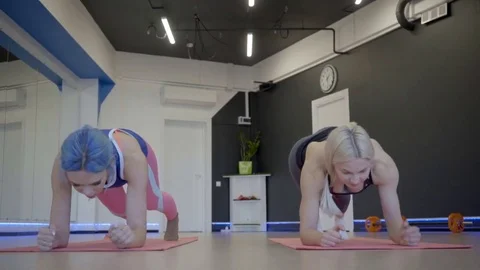 The young client is learning how to do tricep extensions during the private Stock Footage 83121338