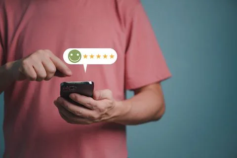 Young client man using smartphone ,customer service and five stars satisfacti Stock Photos