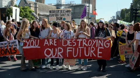 Young climate change protesters waiting for an Extinction Rebellion march to  Stock Footage 121117605