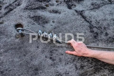 Young climber man hold rope at carabiner Stock Photos