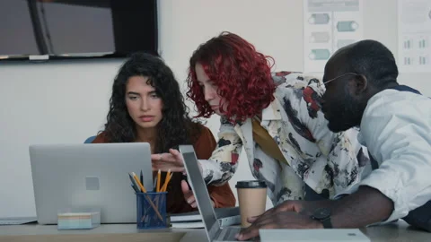 Young Co-workers Trying To Solve Problem Video stock 228504730