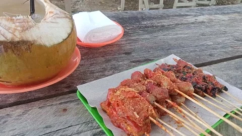 Young coconut and satay Stock Footage 227715374