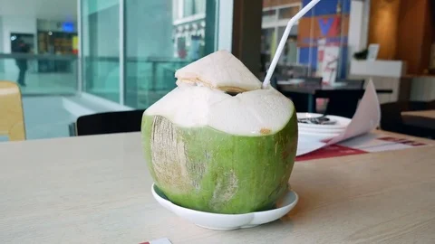 Young Coconut with a straw Stock Footage 80017888