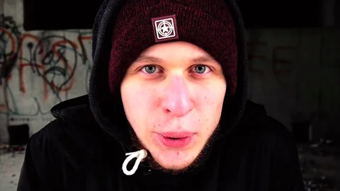 Young in cold winter man screaming into the camera Stock Footage 82794676