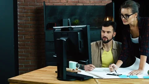 Young colleagues discussing ideas Stock Footage 92121981
