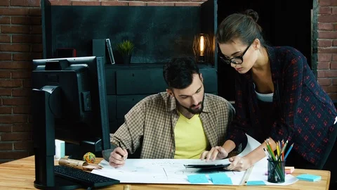 Young colleagues discussing ideas Stock Footage 92126758
