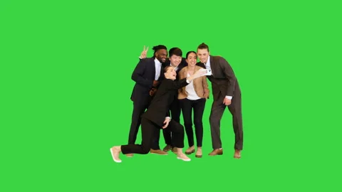 Young colleagues making fast selfie and smiling on a Green Screen, Chroma Key. Stock-Footage 156985645