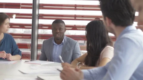 Young colleagues sharing their ideas in a meeting in start-up company 動画素材 73883461