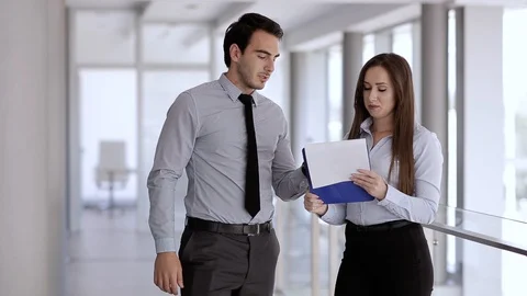 Young Colleagues Talking About Work Tasks Stock Footage 87394716