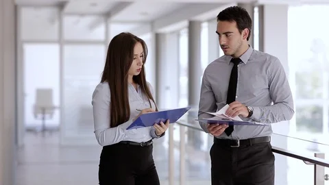 Young Colleagues Talking About Work Tasks Stock Footage 87394903