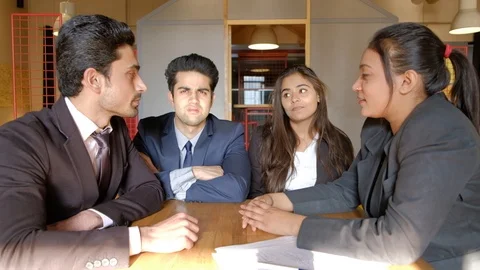 Young colleagues try to console and help their colleague as they tell her that t Stock Footage 104539195