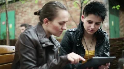 Young college students using a tablet computer, steadicam shot HD Stock Footage 10915805