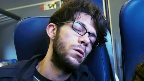 Young commute man sleep in the train Stock Footage 75473239