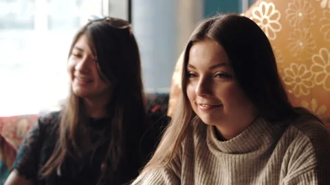 Young company is having fun and eating in bar. smoking a hookah, communicating Stock Footage 87186775