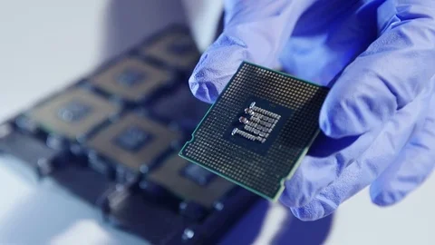Young Computer Engineer is Holding and Inspecting Processor. Stock Footage 84406390