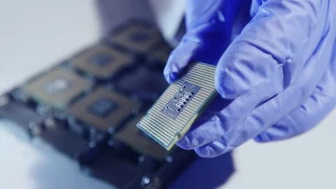 Young Computer Engineer is Holding and Inspecting Processor. 動画素材 84407360