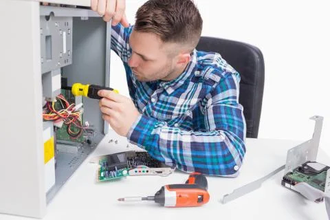 Young computer engineer working on cpu Foto stock
