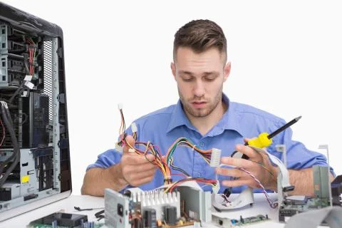 Young computer engineer working on cpu parts Stock Photos