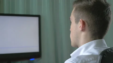 Young computer programmer coding at his desk Stock Footage 46743353