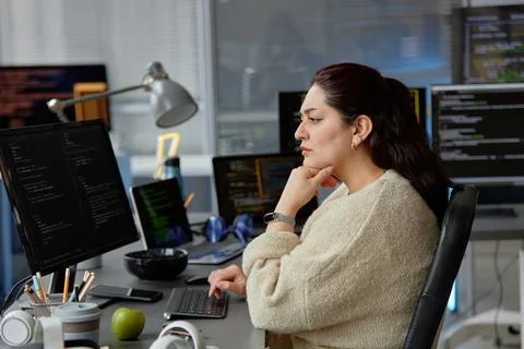 Young Computer Programmer Finding Bugs in Code Stock Photos