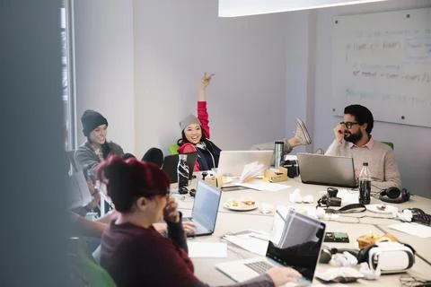 Young computer programmers working at laptops in conference room Stock-Fotos