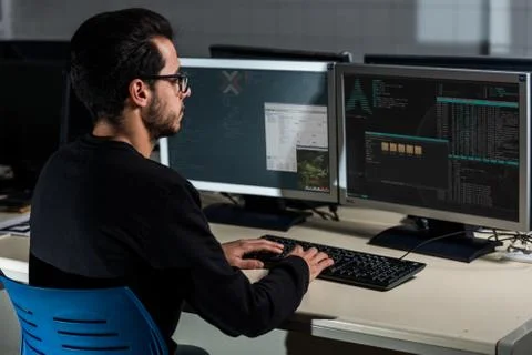 Young computer science student developing with his computer on a Linux System Stock Photos