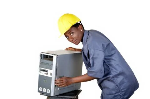 Young computer worker is in the process of maintaining a central computer uni Stock Photos
