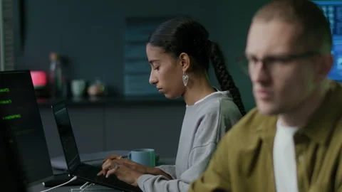 Young Concentrated Diverse Programmers Working on PC in Office at Night Video stock 292618338