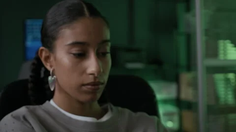 Young Concentrated Female Programmer Typing in Evening Computer Office Stock Footage 292615934