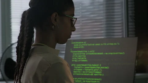 Young Concentrated Female Programmer Typing Program Code in Evening Office Stock Footage 292621290