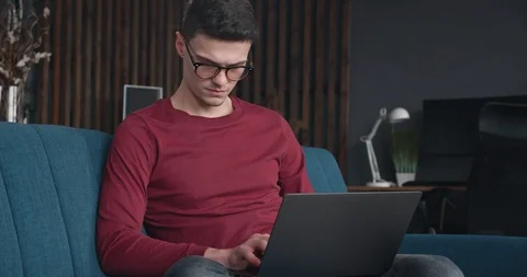 Young concentrated Freelancer is working hard from Home, having a Distant Job Video stock 127327926