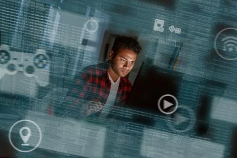 Young concentrated indian computer developer writing new code 스톡 사진