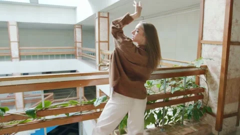 Young Confident Lady Is Dancing Alone Stock Footage 165334182