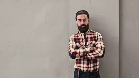 Young confident man standing on a wall Stock Footage 59237919