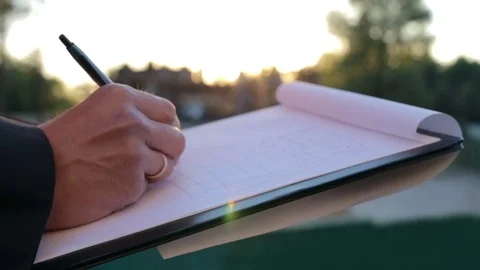 Young construction engineer making notes at construction site Stock Footage 82307676