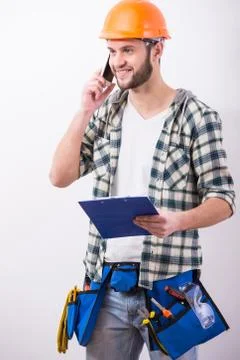 Young construction man with a project on building. Stock Photos