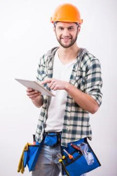 Young construction man with a project on building. Foto stock