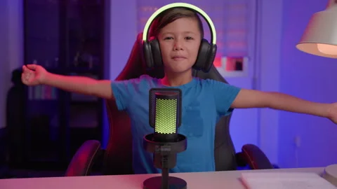 Young Content Creator Sings With Arms Outstretched at Microphone in Home Studio Stock Footage 345963268