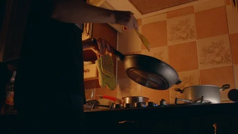 Young cook preparing bacon and potatoes Stock Footage 117940425