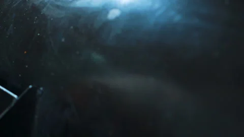 Young cook is taking fried meat from grill in kitchen indoors. Stock Footage 87323361