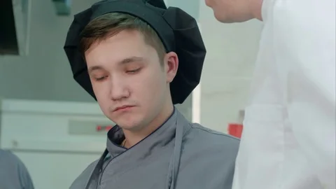 Young cook trainee tasting seafood dish Video stock 72326073